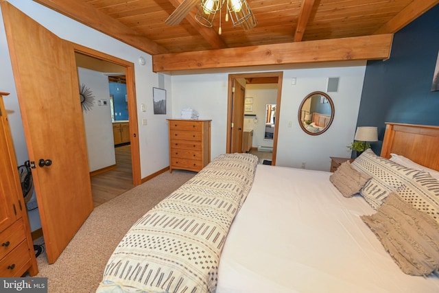 bedroom featuring wood ceiling, light carpet, beam ceiling, and baseboards