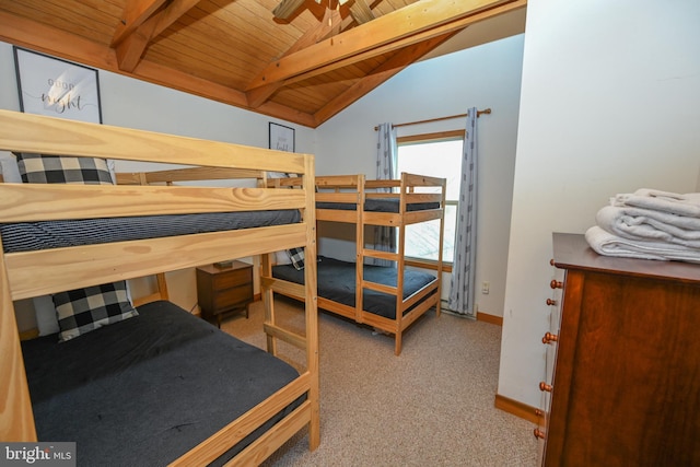 bedroom featuring vaulted ceiling with beams, light carpet, wood ceiling, and baseboards