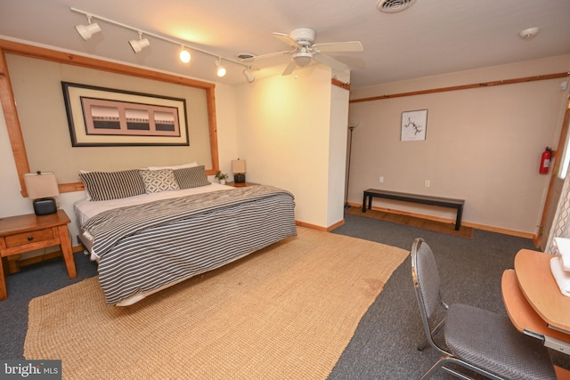 bedroom featuring ceiling fan, visible vents, and baseboards