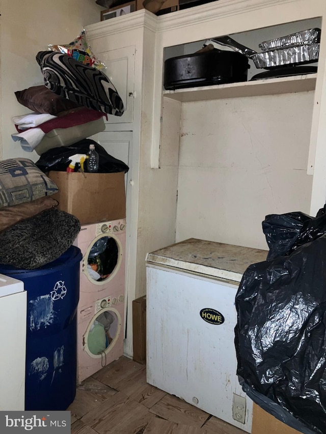 laundry area with washer / dryer, laundry area, and wood finished floors