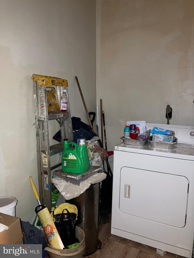 laundry room featuring laundry area and washer / dryer