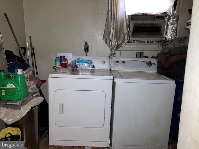 laundry area with laundry area and washer and clothes dryer