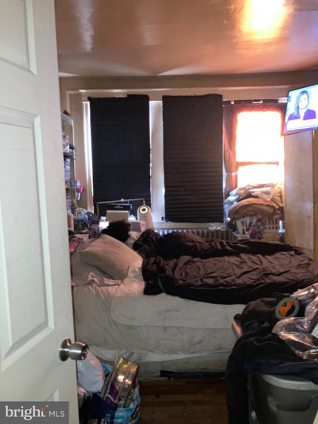 bedroom with wood finished floors