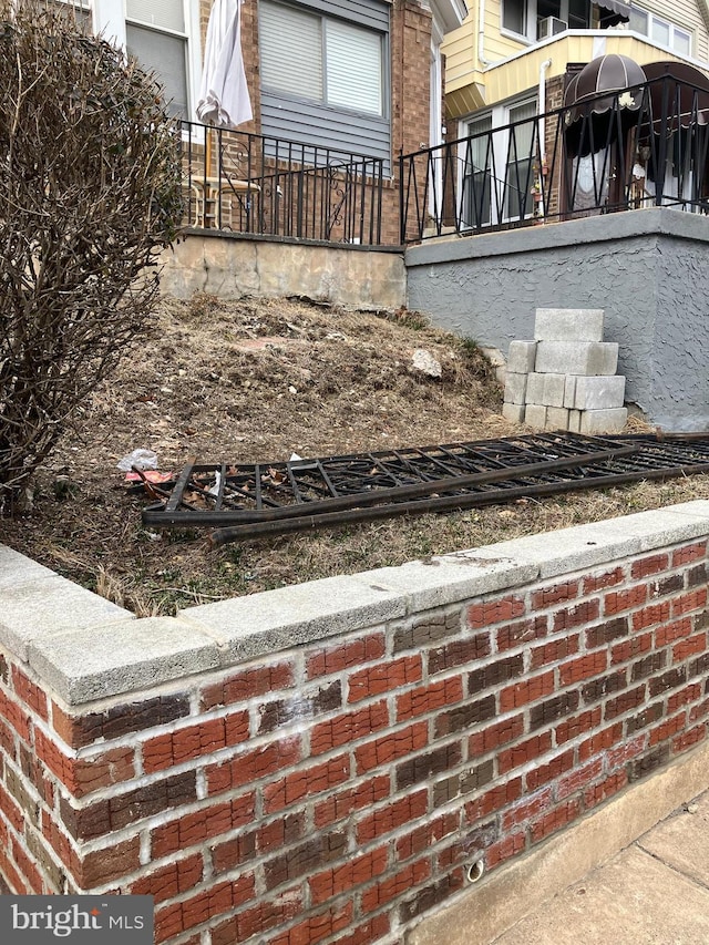 exterior space featuring brick siding