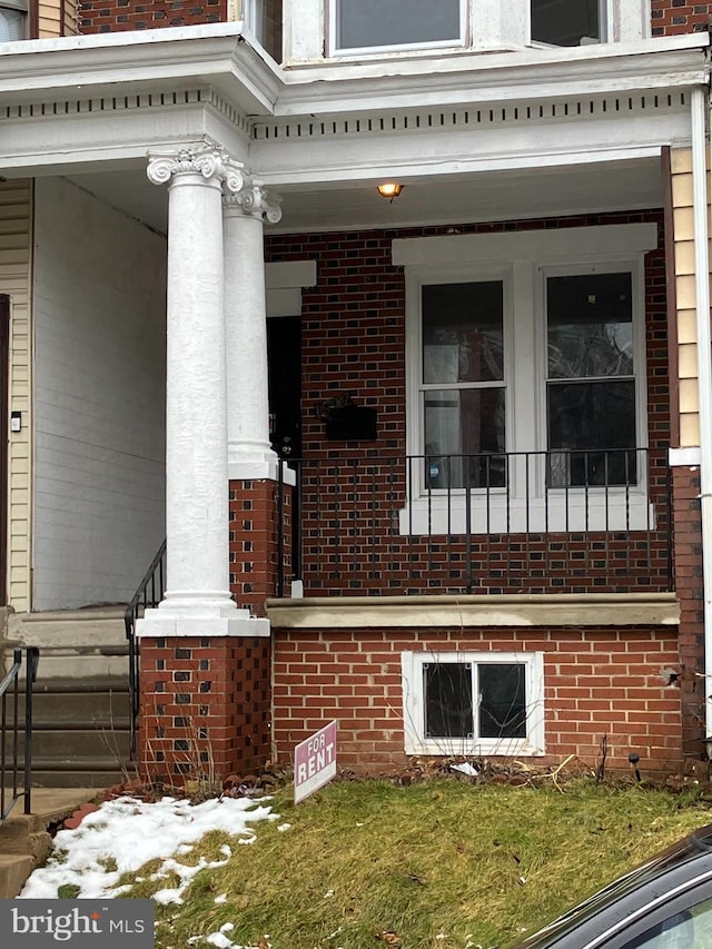 view of property exterior with brick siding