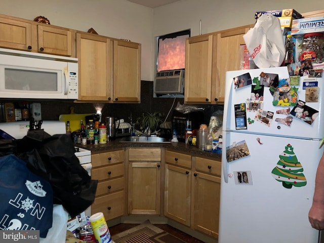 2516 S 6th St, Philadelphia, PA 19148 - kitchen with dark countertops, white appliances, cooling unit, and a sink