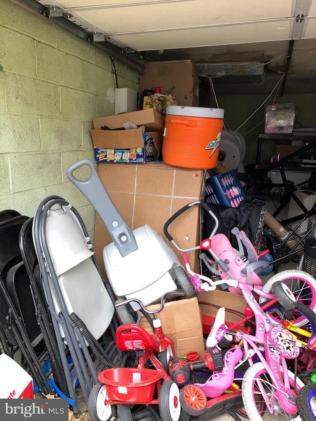 garage with concrete block wall