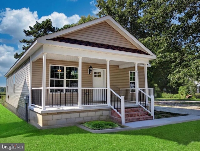 view of front facade with a front lawn and a porch