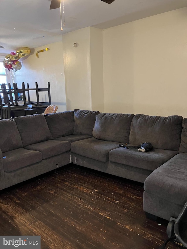 living area with ceiling fan and wood finished floors