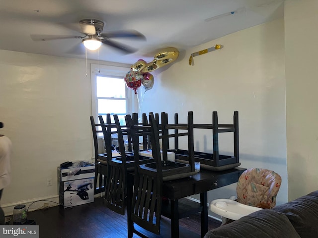 dining space featuring a ceiling fan and wood finished floors