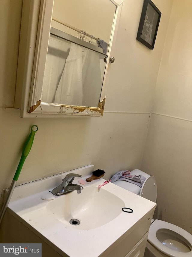 bathroom with vanity and toilet