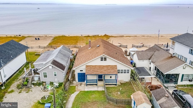 aerial view with a water view and a residential view