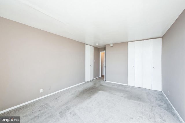 unfurnished bedroom with carpet and baseboards