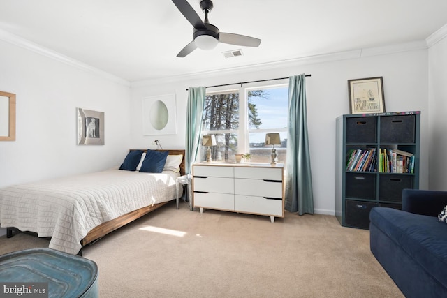 bedroom featuring crown molding, visible vents, light carpet, ceiling fan, and baseboards