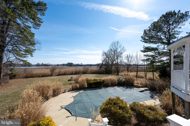 view of pool with a covered pool, a patio, and a diving board