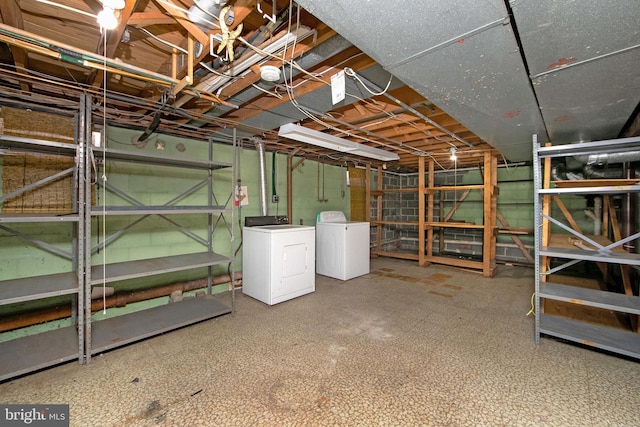 unfinished basement featuring washer and dryer