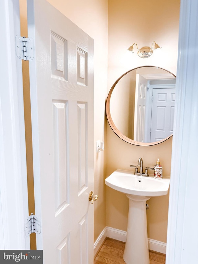 bathroom featuring baseboards and wood finished floors