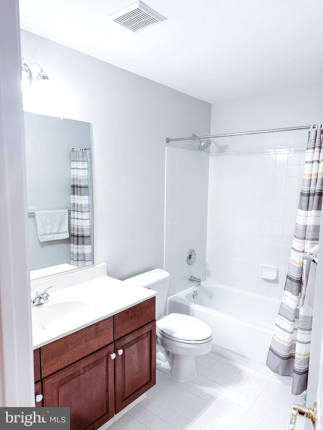 bathroom featuring visible vents, toilet, shower / bath combo with shower curtain, vanity, and tile patterned floors