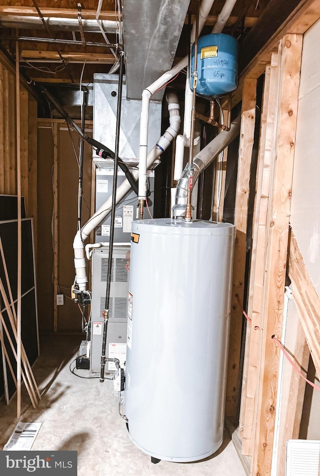 utility room featuring water heater