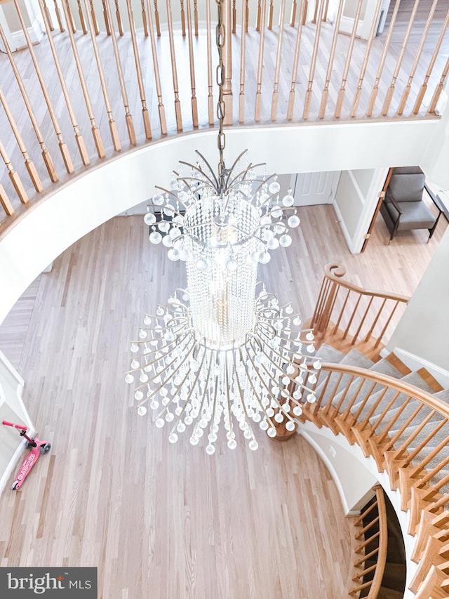 interior space featuring a notable chandelier and wood finished floors