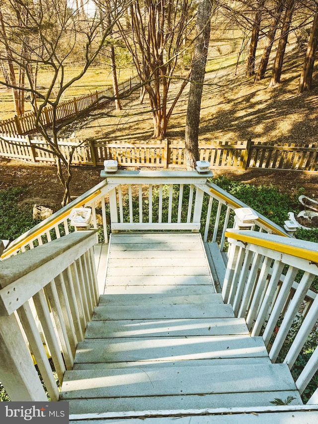 wooden deck featuring fence