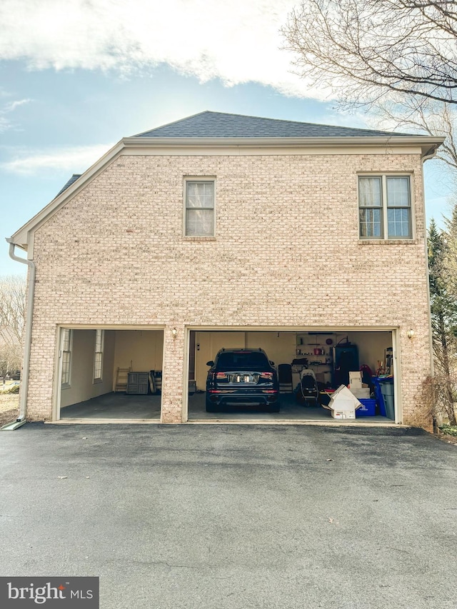 view of home's exterior with brick siding