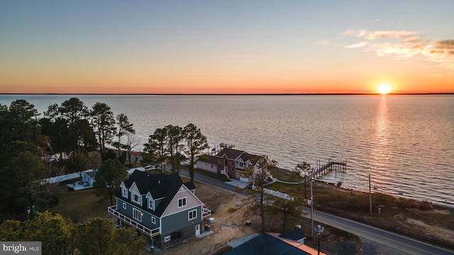 aerial view at dusk with a water view