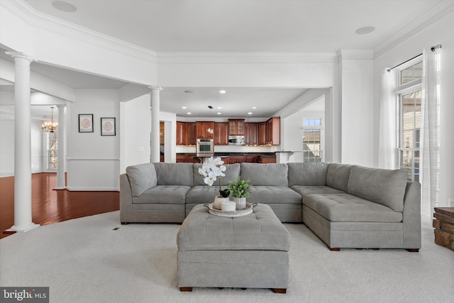 living room with recessed lighting, light colored carpet, decorative columns, and crown molding