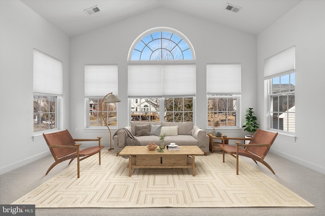 sunroom featuring visible vents and vaulted ceiling