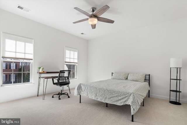 bedroom featuring carpet, visible vents, and ceiling fan