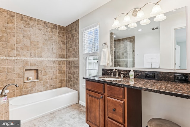 full bath featuring visible vents, a washtub, tile patterned flooring, a shower, and vanity