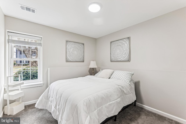 bedroom featuring visible vents, baseboards, and carpet floors