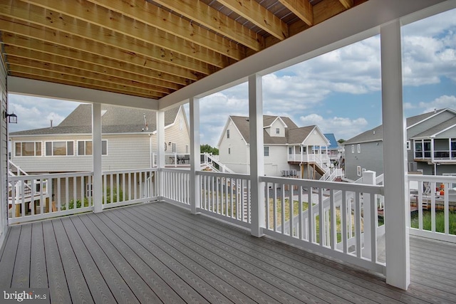 wooden deck with a residential view