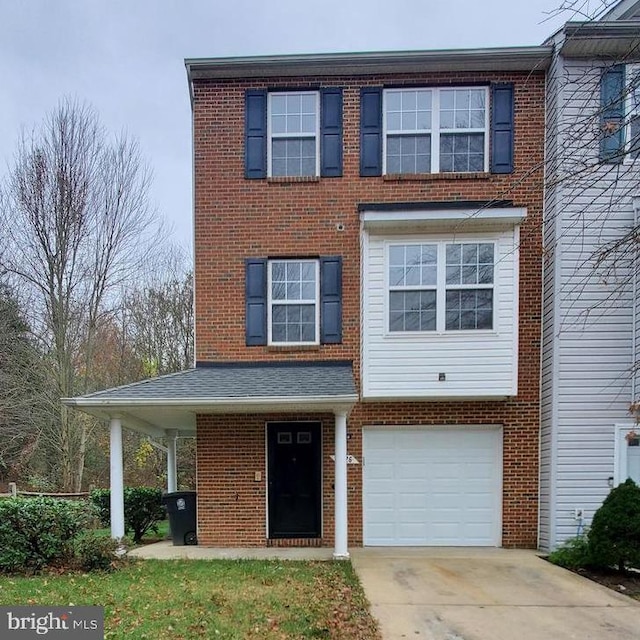 5626 Fishermens Ct, Clinton, MD 20735 - view of front of house with driveway, a garage, and brick siding