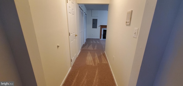 hallway with electric panel, dark carpet, and baseboards