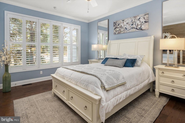 bedroom with a ceiling fan, visible vents, baseboards, dark wood finished floors, and crown molding