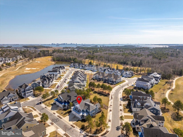 birds eye view of property featuring a residential view and a water view