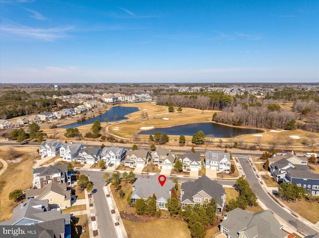 birds eye view of property with a water view and a residential view