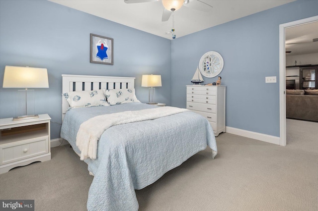 bedroom with baseboards, light colored carpet, and ceiling fan