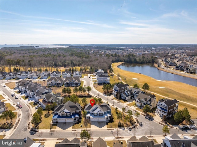 drone / aerial view featuring a residential view and a water view