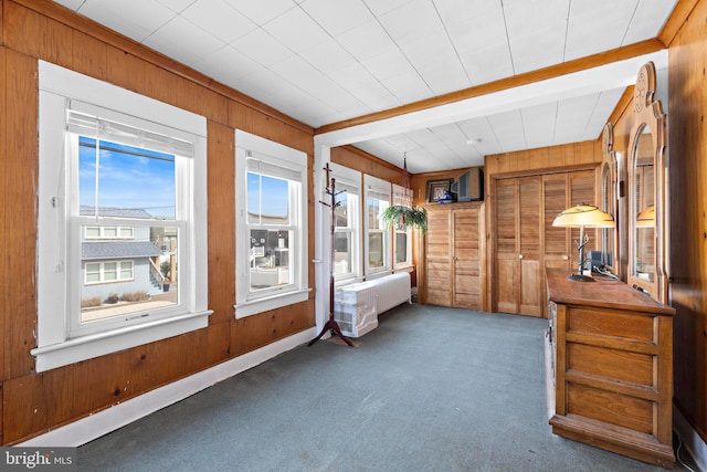 sunroom with beamed ceiling