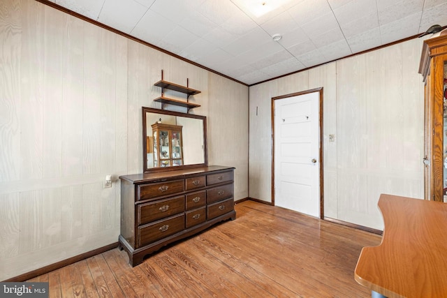 interior space with hardwood / wood-style flooring and ornamental molding