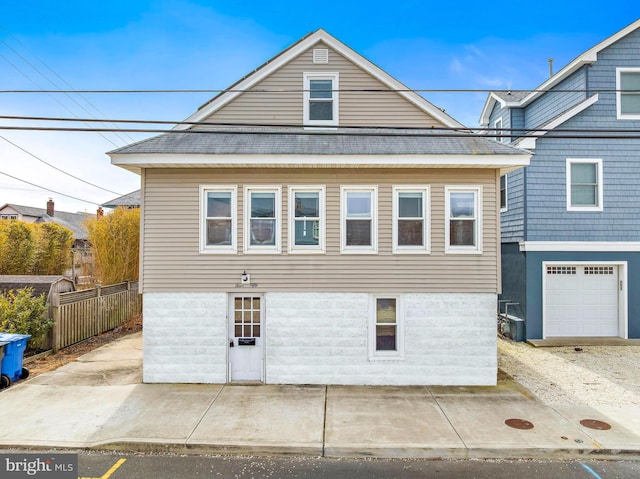 view of home's exterior featuring fence