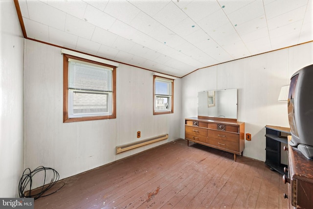 interior space featuring light wood-type flooring and a baseboard heating unit