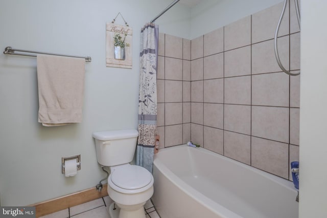 bathroom featuring shower / bath combo, tile patterned flooring, and toilet