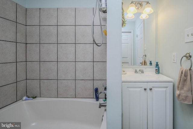 bathroom with a bathtub and vanity