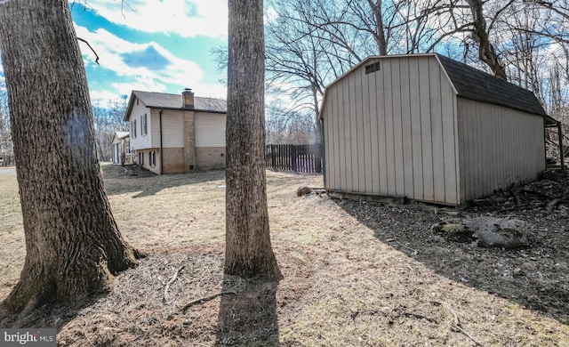 view of shed with fence