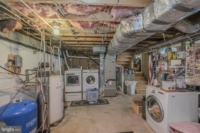 unfinished below grade area with heating unit, water heater, and washer and clothes dryer