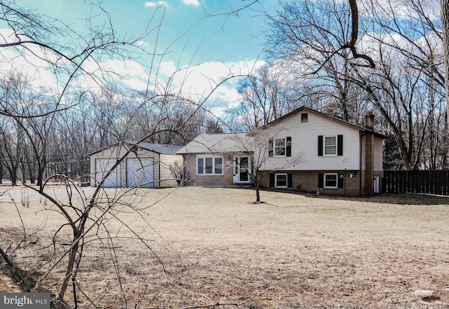 view of front of house featuring driveway, a chimney, an attached garage, and fence