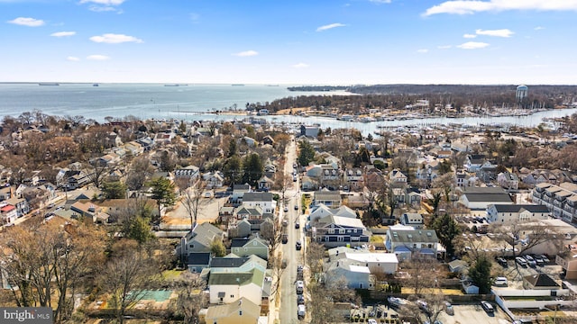 birds eye view of property featuring a water view and a residential view